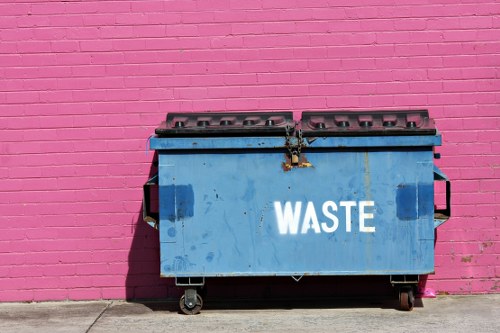 Front view of a commercial waste collection vehicle at a business site