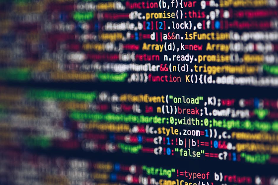 A close-up image of a computer screen displaying lines of programming code with multicolored syntax highlighting, including keywords, variables, and functions in shades of red, green, blue, yellow, an